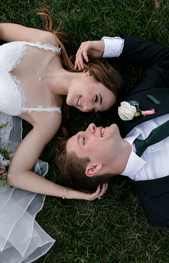 An artist applying bridal makeup in natural light.